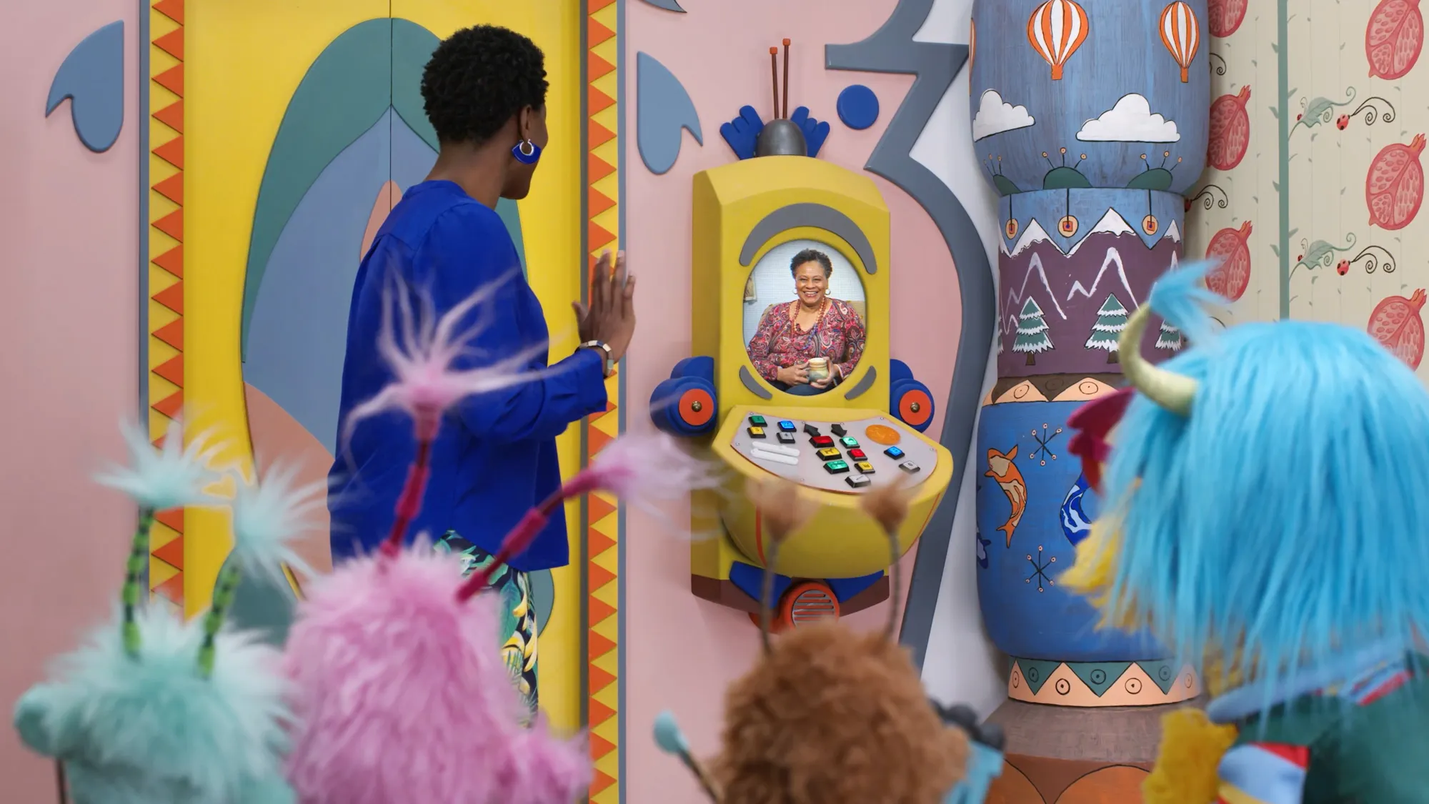 A wide shot of the Albie's Elevator interior with characters gathered around the elevator control panel.