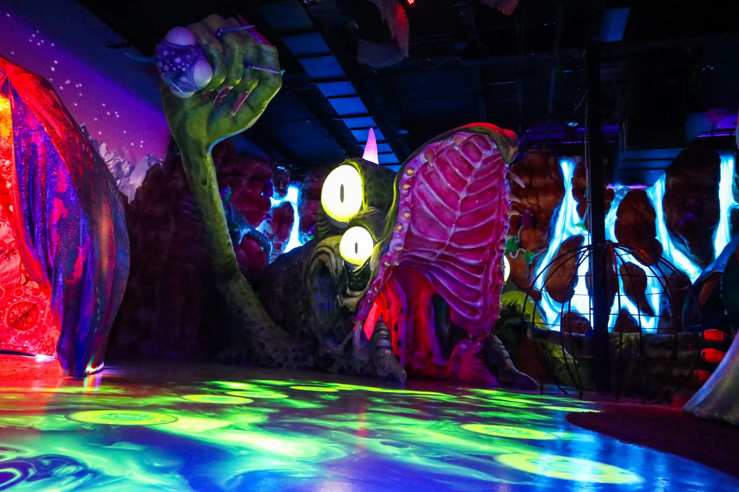 A vivid Otherworld interior, with layered LED lighting wrapping the architecture and creating a fully immersive environment.